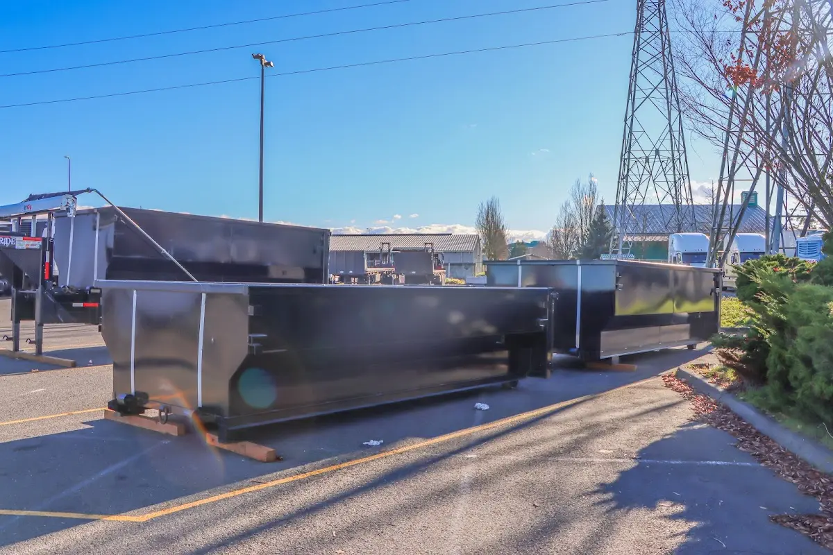Roll-off dumpster ready for waste disposal at job site for 2 Yard Dumpster Rental in Ipswich